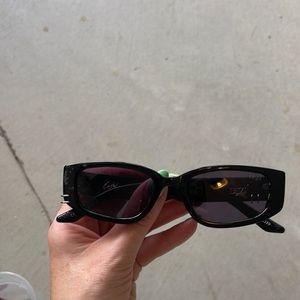 Dezi sunglasses with piercings.